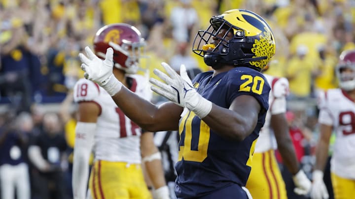 Sep 21, 2024; Ann Arbor, Michigan, USA;  Michigan Wolverines running back Kalel Mullings (20) celebrates after he rushes for a touchdown in the second half against the USC Trojans at Michigan Stadium.
