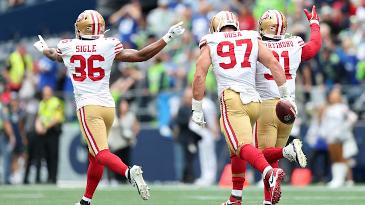 San Francisco 49ers safety Marques Sigle (L), defensive end Nick Bosa (C) and defensive end Sam Okuayinonu (R)