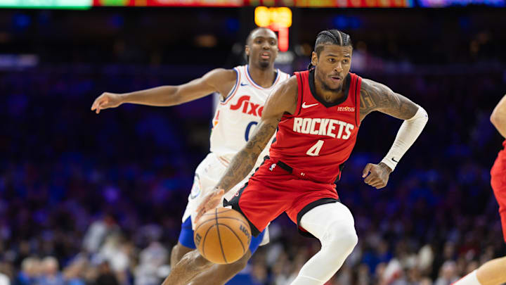 Nov 27, 2024; Philadelphia, Pennsylvania, USA; Houston Rockets guard Jalen Green (4) dribbles past Philadelphia 76ers guard Tyrese Maxey (0) during the third quarter at Wells Fargo Center. Mandatory Credit: Bill Streicher-Imagn Images