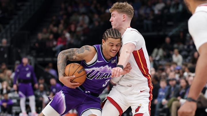 Jan 24, 2026; Salt Lake City, Utah, USA;  Utah Jazz guard Keyonte George (3) runs into Miami Heat guard Kasparas Jakučionis (25) during the second half at Delta Center. Mandatory Credit: Chris Nicoll-Imagn Images