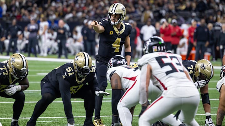 Jan 7, 2024; New Orleans, Louisiana, USA;  New Orleans Saints quarterback Derek Carr (4) points at the Atlanta Falcons defense during the second half at Caesars Superdome. Mandatory Credit: Stephen Lew-Imagn Images