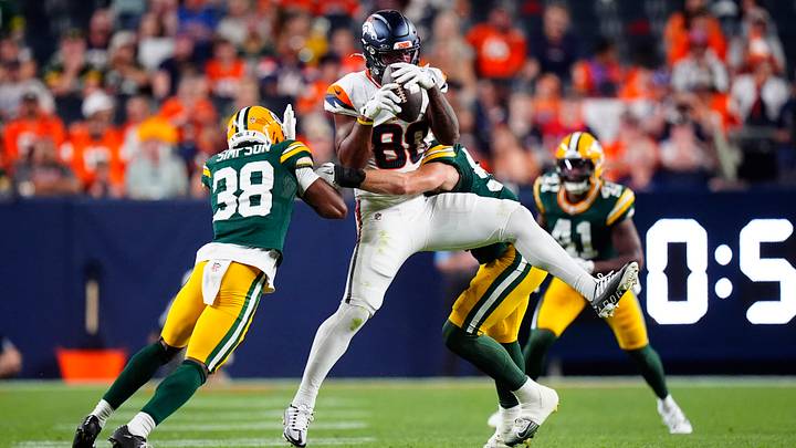 Denver Broncos tight end Justin Joly (80) pulls in front Green Bay Packers safety Trey Dean (38) in the second half during a preseason game at Empower Field at Mile High. 