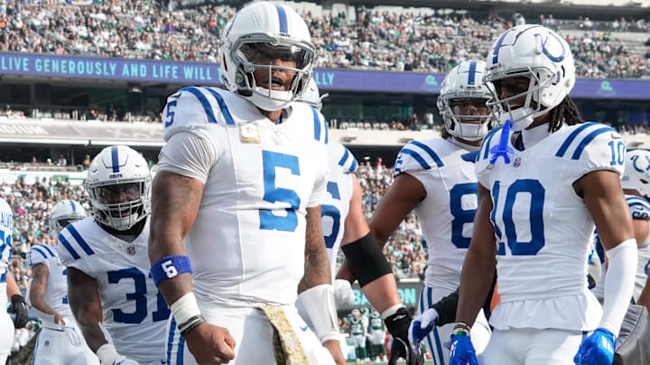 Nov 17, 2024; East Rutherford, New Jersey, USA; Indianapolis Colts quarterback Anthony Richardson (5) celebrates after scoring a touchdown over the New York Jets in the first half at MetLife Stadium. Mandatory Credit: Robert Deutsch-Imagn Images