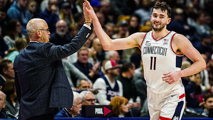 Jan 2, 2024; Storrs, Connecticut, USA; Connecticut Huskies head coach Dan Hurley congratulates forward Alex Karaban (11) coming off the court as they take on the DePaul Blue Demons at Harry A. Gampel Pavilion. Mandatory Credit: David Butler II-Imagn Images