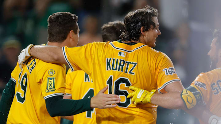 Jun 19, 2025; West Sacramento, California, USA; Athletics first baseman Nick Kurtz (16) celebrates with teammates after hitting a walk-off two run home run during the tenth inning against the Houston Astros at Sutter Health Park. Mandatory Credit: Sergio Estrada-Imagn Images Jun 19, 2025; West Sacramento, California, USA; Athletics first baseman Nick Kurtz (16) celebrates with teammates after hitting a walk-off two run home run during the tenth inning against the Houston Astros at Sutter Health Park. Mandatory Credit: Sergio Estrada-Imagn Images