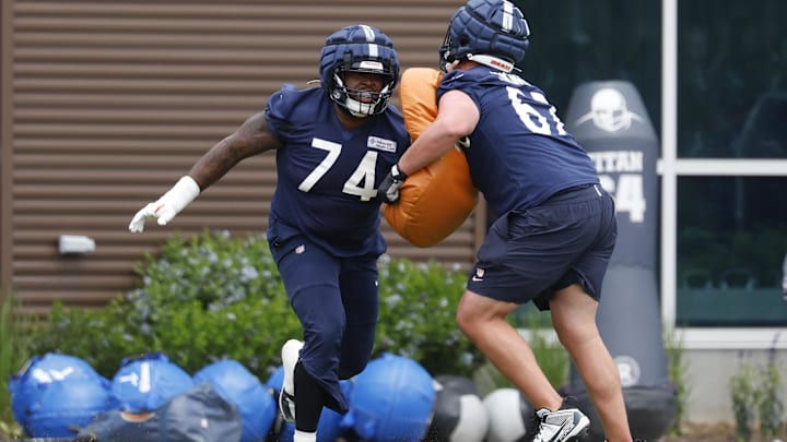 Bears guard Jordan McFadden works with the pads during minicamp last year.