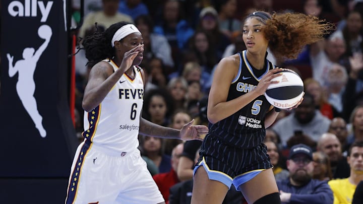 Jun 7, 2025; Chicago, Illinois, USA; Chicago Sky forward Angel Reese (5) drives to the basket against Indiana Fever forward Natasha Howard (6) during the first half of a WNBA game at United Center. Mandatory Credit: Kamil Krzaczynski-Imagn Images