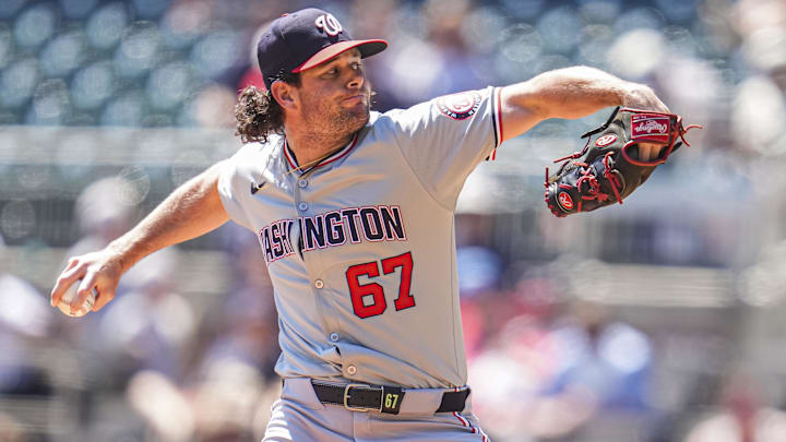 Aug 25, 2024; Cumberland, Georgia, USA; Washington Nationals relief pitcher Kyle Finnegan (67) pitches against the Atlanta Braves during the ninth inning at Truist Park. Mandatory Credit: Dale Zanine-Imagn Images