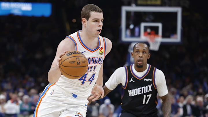 Apr 12, 2026; Oklahoma City, Oklahoma, USA; Oklahoma City Thunder guard Nikola Topic (44) drives around Phoenix Suns guard Jamaree Bouyea (17) during the second half at Paycom Center. Mandatory Credit: Alonzo Adams-Imagn Images