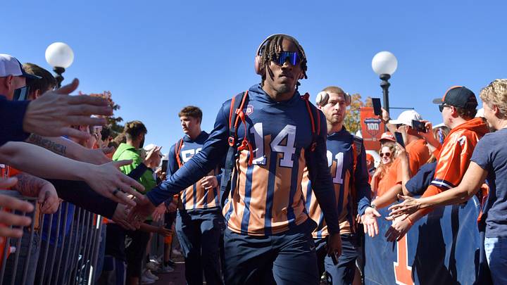 Oct 19, 2024; Champaign, Illinois, USA; Illinois Fighting Illini defensive back Xavier Scott (14) and teammates do the Illini Walk before kickoff against the Michigan Wolverines game at Memorial Stadium. Mandatory Credit: Ron Johnson-Imagn Images Oct 19, 2024; Champaign, Illinois, USA; Illinois Fighting Illini defensive back Xavier Scott (14) and teammates do the Illini Walk before kickoff against the Michigan Wolverines game at Memorial Stadium. Mandatory Credit: Ron Johnson-Imagn Images