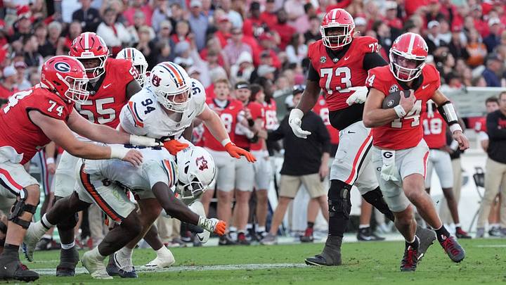 Georgia football QB Gunner Stockton runs against Auburn at Sanford Stadium. Georgia football QB Gunner Stockton runs against Auburn at Sanford Stadium.