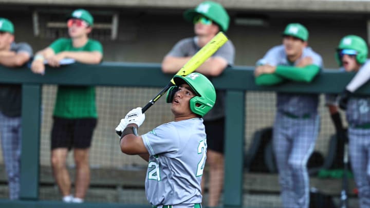 Mason catcher Mark Rutherford (21) swings the bat during the Comets' 9-5 win over Elder in the OHSAA DI regional semifinal at Hayden Park at Miami University Thursday, May 30, 2024.