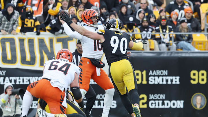 Nov 16, 2025; Pittsburgh, Pennsylvania, USA; Cincinnati Bengals quarterback Joe Flacco (16) looks to pass the ball as Pittsburgh Steelers linebacker T.J. Watt (90) defends during the first half at Acrisure Stadium. Mandatory Credit: Charles LeClaire-Imagn Images