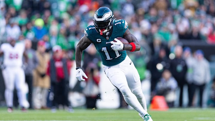 Dec 31, 2023; Philadelphia, Pennsylvania, USA; Philadelphia Eagles wide receiver A.J. Brown (11) runs with the ball during the fourth quarter against the Arizona Cardinals at Lincoln Financial Field. Mandatory Credit: Bill Streicher-Imagn Images