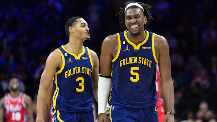 Dec 16, 2022; Philadelphia, Pennsylvania, USA; Golden State Warriors guard Jordan Poole (3) talks with center Kevon Looney (5) during a break in action against the Philadelphia 76ers during the fourth quarter at Wells Fargo Center. Mandatory Credit: Bill Streicher-Imagn Images