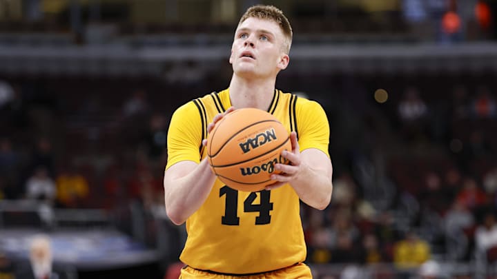 Mar 11, 2026; Chicago, IL, USA; Iowa Hawkeyes guard Bennett Stirtz (14) shoots a free throw against the Maryland Terrapins during the second half at United Center. Mandatory Credit: Kamil Krzaczynski-Imagn Images