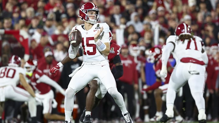 Dec 19, 2025; Norman, OK, USA; Alabama Crimson Tide quarterback Ty Simpson (15) looks to make a pass in the first half against the Oklahoma Sooners at Gaylord Family OK Memorial Stadium. Mandatory Credit: Mark J. Rebilas-Imagn Images