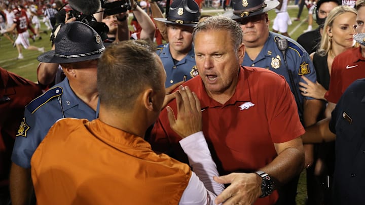 Sep 11, 2021; Fayetteville, Arkansas, USA; Arkansas Razorbacks head coach Sam Pittman talks to Texas Longhorns head coach Steve Sarkisian after the game at Donald W. Reynolds Razorback Stadium. Arkansas won 40-21. Mandatory Credit: Nelson Chenault-Imagn Images Sep 11, 2021; Fayetteville, Arkansas, USA; Arkansas Razorbacks head coach Sam Pittman talks to Texas Longhorns head coach Steve Sarkisian after the game at Donald W. Reynolds Razorback Stadium. Arkansas won 40-21. Mandatory Credit: Nelson Chenault-Imagn Images