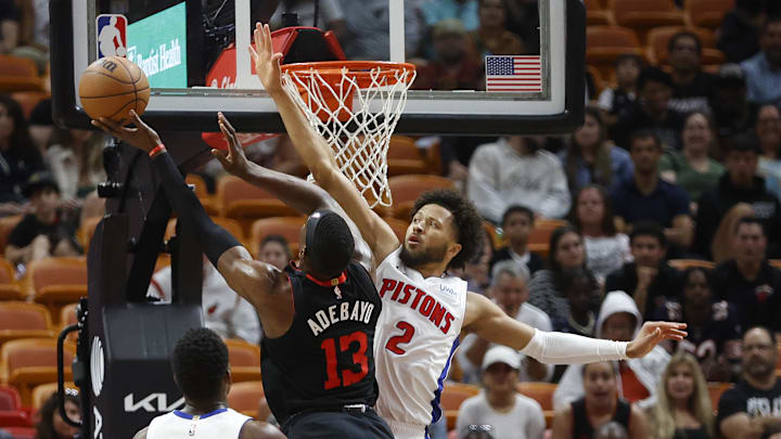 Mar 5, 2024; Miami, Florida, USA; Detroit Pistons guard Cade Cunningham (2) defends Miami Heat center Bam Adebayo (13) during the first half at Kaseya Center. Mandatory Credit: Rhona Wise-Imagn Images