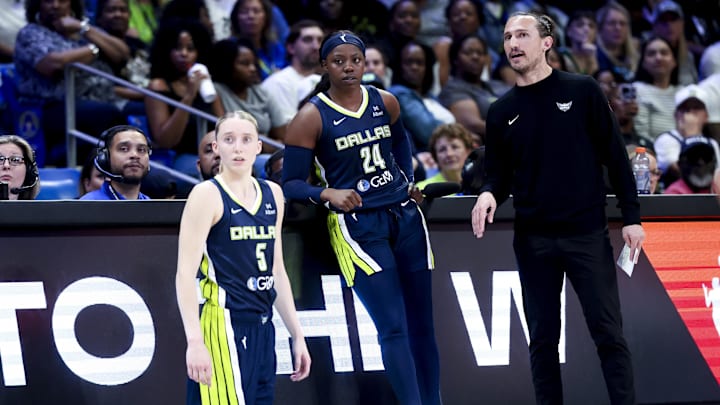 May 16, 2025; Arlington, Texas, USA; Dallas Wings guard Paige Bueckers (5) and Dallas Wings guard Arike Ogunbowale (24) and Dallas Wings head coach Chris Koclanes talk against the Minnesota Lynx during the first half at College Park Center. Mandatory Credit: Kevin Jairaj-Imagn Images May 16, 2025; Arlington, Texas, USA; Dallas Wings guard Paige Bueckers (5) and Dallas Wings guard Arike Ogunbowale (24) and Dallas Wings head coach Chris Koclanes talk against the Minnesota Lynx during the first half at College Park Center. Mandatory Credit: Kevin Jairaj-Imagn Images