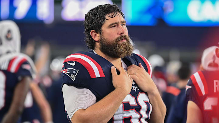 August 8, 2024; Foxborough, MA, USA;  New England Patriots center David Andrews (60) watches from the sideline during the first half against the Carolina Panthers at Gillette Stadium.