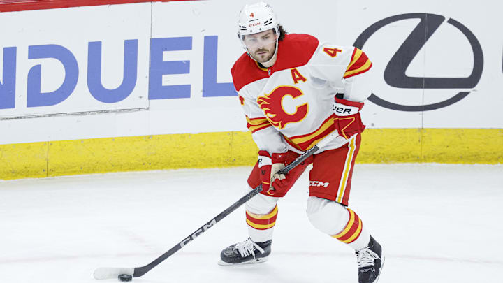 Jan 13, 2025; Chicago, Illinois, USA; Calgary Flames defenseman Rasmus Andersson (4) looks to pass the puck against the Chicago Blackhawks during the second period at United Center. Mandatory Credit: Kamil Krzaczynski-Imagn Images Jan 13, 2025; Chicago, Illinois, USA; Calgary Flames defenseman Rasmus Andersson (4) looks to pass the puck against the Chicago Blackhawks during the second period at United Center. Mandatory Credit: Kamil Krzaczynski-Imagn Images