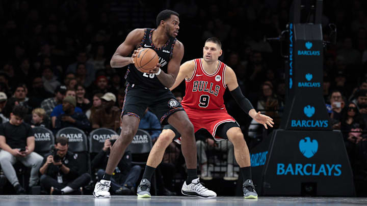 Jan 16, 2026; Brooklyn, New York, USA; Brooklyn Nets center Day'ron Sharpe (20) is guarded by Chicago Bulls center Nikola Vucevic (9) during the second half at Barclays Center. Mandatory Credit: Vincent Carchietta-Imagn Images