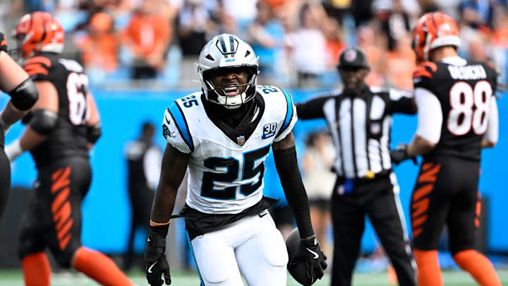 Sep 29, 2024; Charlotte, North Carolina, USA; Carolina Panthers safety Xavier Woods (25) celebrates after intercepting a pass in the fourth quarter at Bank of America Stadium. Mandatory Credit: Bob Donnan-Imagn Images