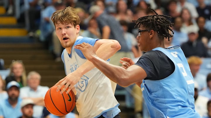Oct 4, 2025; Charlotte, NC, USA; North Carolina Tar Heels center Henri Veesaar (13) with the ball as forward James Brown (2) defends in the first half at Dean E. Smith Center. Mandatory Credit: Bob Donnan-Imagn Images Oct 4, 2025; Charlotte, NC, USA; North Carolina Tar Heels center Henri Veesaar (13) with the ball as forward James Brown (2) defends in the first half at Dean E. Smith Center. Mandatory Credit: Bob Donnan-Imagn Images