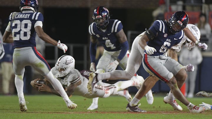 Nov 29, 2024; Oxford, Mississippi, USA; Mississippi State Bulldogs quarterback Michael Van Buren Jr. (0) attempts to dive for a first down against the Mississippi Rebels during the third quarter at Vaught-Hemingway Stadium. Mandatory Credit: Matt Bush-Imagn Images
