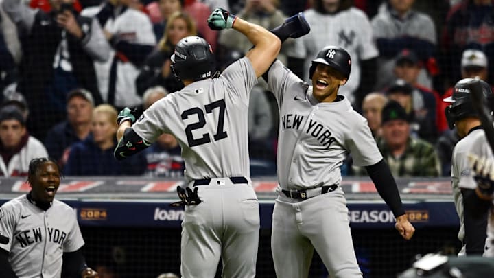 Oct 18, 2024; Cleveland, Ohio, USA; New York Yankees designated hitter Giancarlo Stanton (27) celebrates with outfielder Juan Soto (22) after hitting a three run home run in the sixth inning against the Cleveland Guardians during game four of the ALCS for the 2024 MLB playoffs at Progressive Field. Mandatory Credit: Ken Blaze-Imagn Images