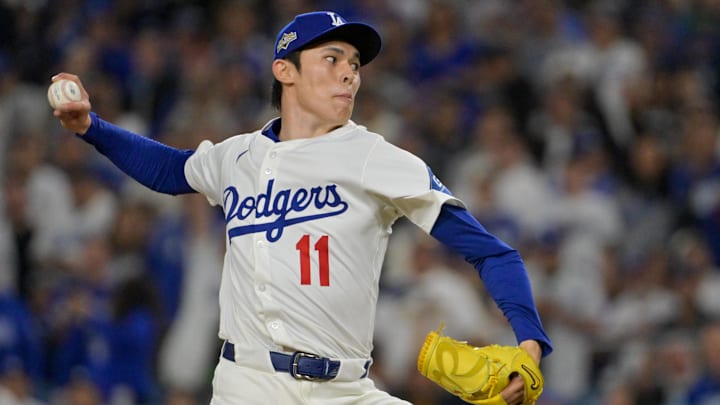 Oct 1, 2025; Los Angeles, California, USA; Los Angeles Dodgers pitcher Roki Sasaki (11) throws a pitch against the Cincinnati Reds in the ninth inning during game two of the Wildcard round for the 2025 MLB playoffs at Dodger Stadium. Mandatory Credit: Jayne Kamin-Oncea-Imagn Images
