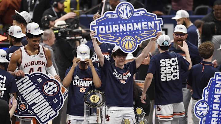 Mar 17, 2024; Nashville, TN, USA; The Auburn Tigers celebrate after defeating the Florida Gators in the SEC Tournament Championship.