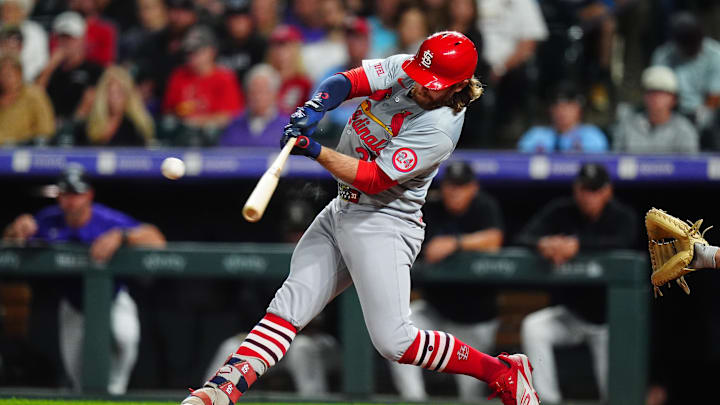 Sep 24, 2024; Denver, Colorado, USA; St. Louis Cardinals outfielder Brendan Donovan (33) singles in the third inning against the Colorado Rockies at Coors Field. Mandatory Credit: Ron Chenoy-Imagn Images