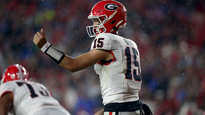 Georgia Bulldogs quarterback Carson Beck (15) gives direction prior to the snap during the second half against the Mississippi Rebels. Georgia Bulldogs quarterback Carson Beck (15) gives direction prior to the snap during the second half against the Mississippi Rebels.