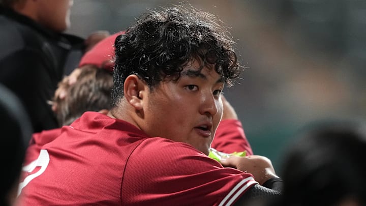 Mar 1, 2025; Stanford, CA, USA; Stanford Cardinal first baseman Rintaro Sasaki (3) leans against the dugout railing during the seventh inning against the Xavier Musketeers at Sunken Diamond. Mandatory Credit: Darren Yamashita-Imagn Images
