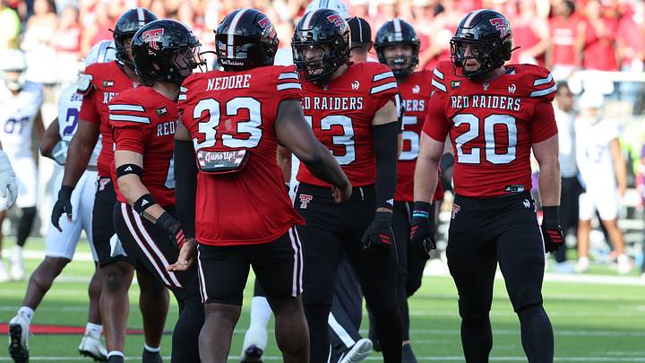 Sep 5, 2026; Lubbock, Texas, USA; Members of the Texas Tech Red Raiders defense react after a play against the Abilene Christian Wildcats in the first half at Galaxy Stadium. Mandatory Credit: Michael C. Johnson-Imagn Images Sep 5, 2026; Lubbock, Texas, USA; Members of the Texas Tech Red Raiders defense react after a play against the Abilene Christian Wildcats in the first half at Galaxy Stadium. Mandatory Credit: Michael C. Johnson-Imagn Images