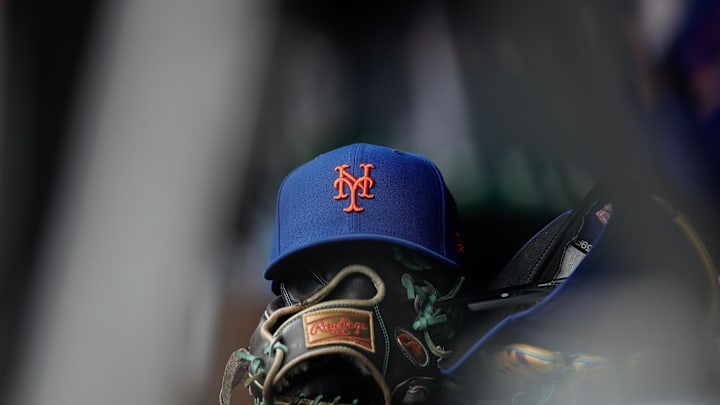 Aug 8, 2024; Denver, Colorado, USA; A New York Mets hat and glove in the dugout in the second inning against the Colorado Rockies at Coors Field. Mandatory Credit: Isaiah J. Downing-Imagn Images