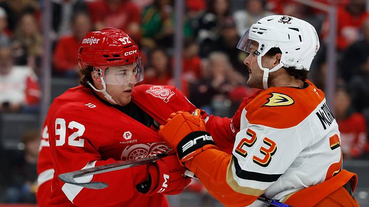Nov 13, 2025; Detroit, Michigan, USA;  Detroit Red Wings center Marco Kasper (92) and Anaheim Ducks center Mason McTavish (23) shove each other in the first period at Little Caesars Arena. Mandatory Credit: Rick Osentoski-Imagn Images