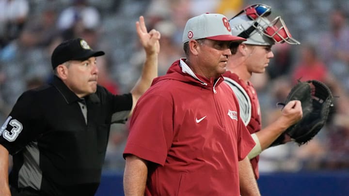 Oklahoma head coach Skip Johnson leaves the mound after a visit during the game with Georgia in the second round of the SEC Baseball Tournament at the Hoover Met. Oklahoma head coach Skip Johnson leaves the mound after a visit during the game with Georgia in the second round of the SEC Baseball Tournament at the Hoover Met.