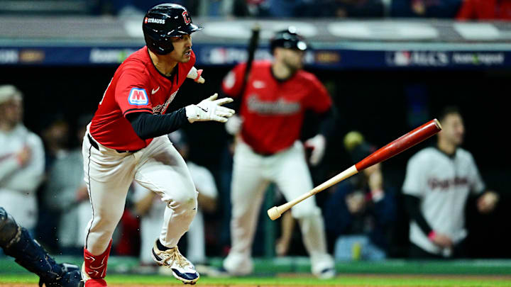 Oct 19, 2024; Cleveland, Ohio, USA; Cleveland Guardians outfielder Steven Kwan (38) hits an RBI single during the fifth inning against the New York Yankees during game five of the ALCS for the 2024 MLB playoffs at Progressive Field. Mandatory Credit: David Dermer-Imagn Images