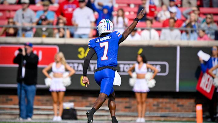 Nov 22, 2025; Dallas, Texas, USA; SMU Mustangs quarterback Kevin Jennings (7) celebrates during the first half against the Louisville Cardinals at Gerald J. Ford Stadium. Mandatory Credit: Jerome Miron-Imagn Images Nov 22, 2025; Dallas, Texas, USA; SMU Mustangs quarterback Kevin Jennings (7) celebrates during the first half against the Louisville Cardinals at Gerald J. Ford Stadium. Mandatory Credit: Jerome Miron-Imagn Images