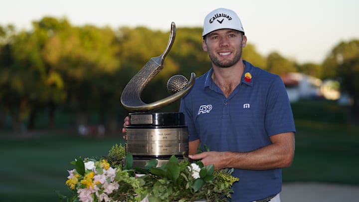 Mar 20, 2022; Palm Harbor, Florida, USA; Sam Burns poses for a picture on the 18th. green after