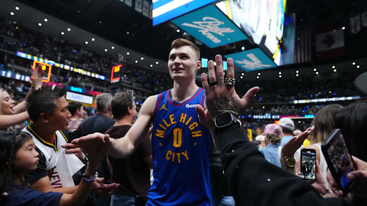May 3, 2025; Denver, Colorado, USA; Denver Nuggets guard Christian Braun (0) celebrates the win over the LA Clippers following game seven of first round for the 2025 NBA Playoffs at Ball Arena. Mandatory Credit: Ron Chenoy-Imagn Images