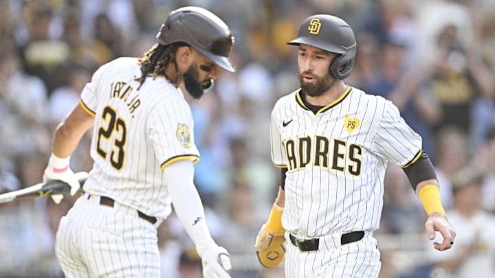 Sep 2, 2024; San Diego, California, USA; San Diego Padres shortstop Mason McCoy (18), right, is congratulated by  Fernando Tatis Jr. (23) after scoring during the third inning against the Detroit Tigers at Petco Park. Mandatory Credit: Denis Poroy-Imagn Images