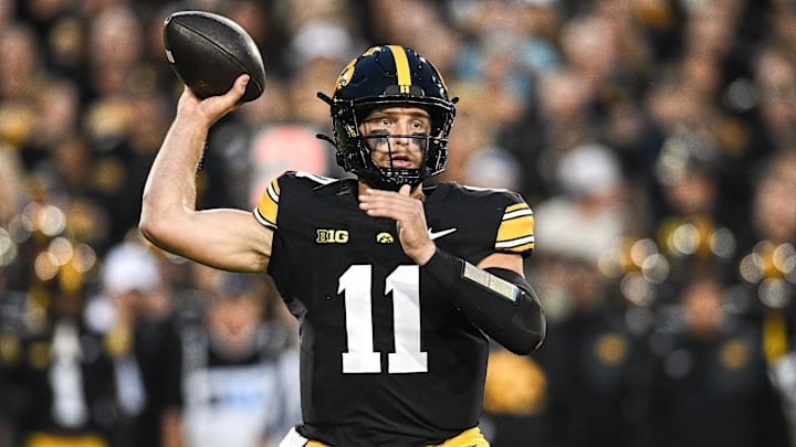 Oct 18, 2025; Iowa City, Iowa, USA; Iowa Hawkeyes quarterback Mark Gronowski (11) throws a pass against the Penn State Nittany Lions during the first quarter at Kinnick Stadium. Mandatory Credit: Jeffrey Becker-Imagn Images Oct 18, 2025; Iowa City, Iowa, USA; Iowa Hawkeyes quarterback Mark Gronowski (11) throws a pass against the Penn State Nittany Lions during the first quarter at Kinnick Stadium. Mandatory Credit: Jeffrey Becker-Imagn Images