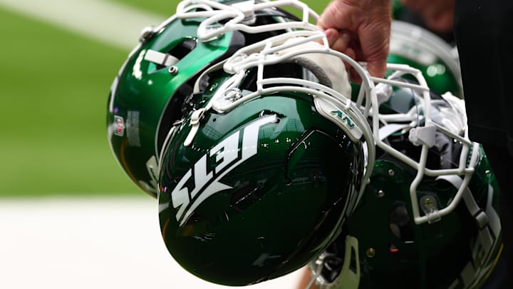 Oct 6, 2024; Tottenham, ENG; New York Jets helmets are held by staff before the match against Minnesota Vikings at Tottenham Hotspur Stadium. Mandatory Credit: Shaun Brooks-Imagn Images Oct 6, 2024; Tottenham, ENG; New York Jets helmets are held by staff before the match against Minnesota Vikings at Tottenham Hotspur Stadium. Mandatory Credit: Shaun Brooks-Imagn Images