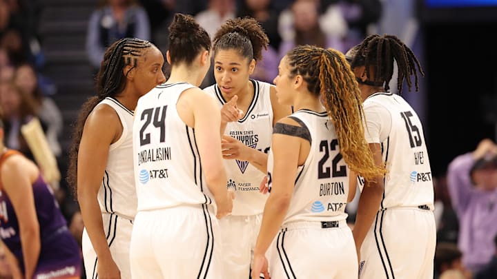Golden State Valkyries players huddle during the fourth quarter against the Phoenix Mercury at Chase Center.