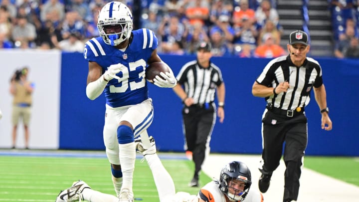 Aug 11, 2024; Indianapolis, Indiana, USA; Indianapolis Colts cornerback Micah Abraham (33) runs past Denver Broncos tight end Nate Adkins (45) for a touchdown during the second half at Lucas Oil Stadium. Mandatory Credit: Marc Lebryk-USA TODAY Sports Aug 11, 2024; Indianapolis, Indiana, USA; Indianapolis Colts cornerback Micah Abraham (33) runs past Denver Broncos tight end Nate Adkins (45) for a touchdown during the second half at Lucas Oil Stadium. Mandatory Credit: Marc Lebryk-USA TODAY Sports