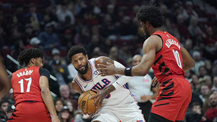 Dec 30, 2024; Portland, Oregon, USA; Philadelphia 76ers forward Paul George (8) looks to pass the ball against Portland Trail Blazers guard Scoot Henderson (00) during the first half at Moda Center. Mandatory Credit: Soobum Im-Imagn Images